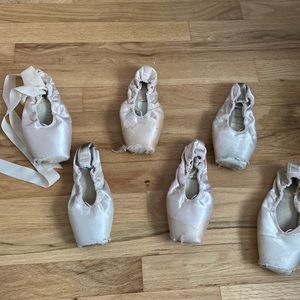 6 used pointe shoes for art